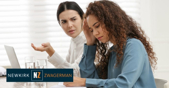 employee being reprimanded by a colleague