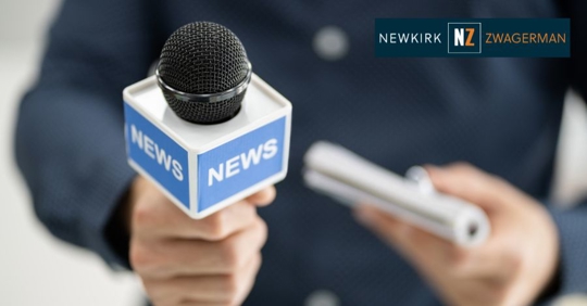 news reporter holding out a mic